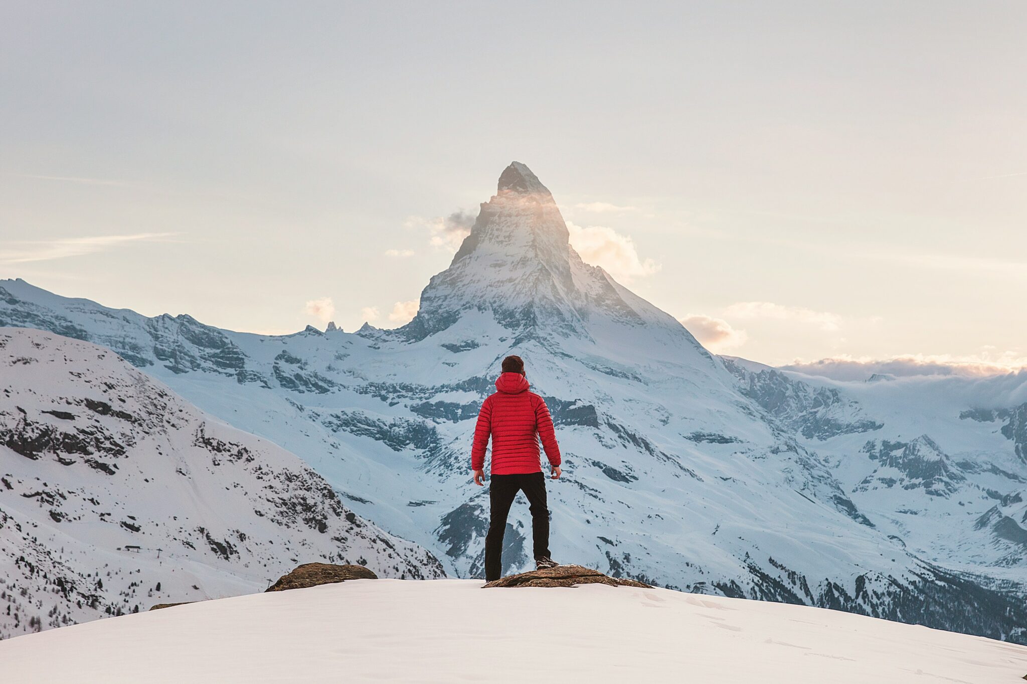 Man staring at a snowy peak